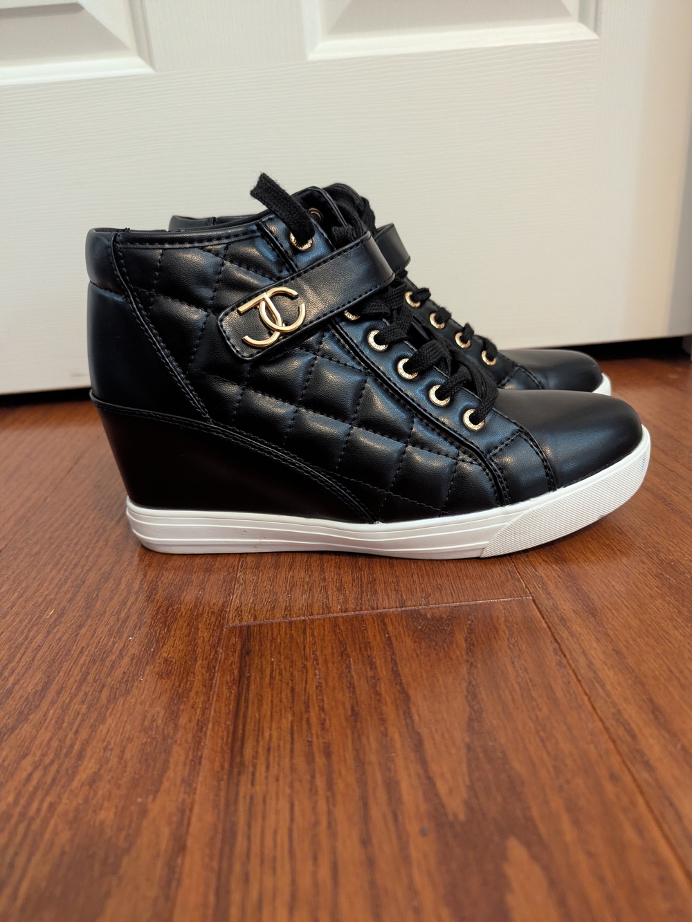 Juicy Couture Black Quilted Wedge Sneaker with Gold Hardware
